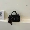 Elegante bolso de bolos de bloques de color de alta calidad para mujer, un bolso de hombro que también se puede llevar cruzado, nuevo bolso tote casual y elegante otoño 2026
