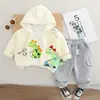 Conjunto de Tres Piezas de Dinosaurio de Dibujos Animados para Bebé Nuevo Estilo Primavera y Otoño 2025 Sudadera con Cremallera Casual para Niños y Niñas Pantalones Deportivos para Bebé