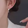 Pendientes de Estrella de Circonita Dulces y Frescos Versión Coreana Moda de Comercio Exterior Europeo y Americano Diseño Creativo Pendientes de Estrella de Cuatro Puntas Giratorios