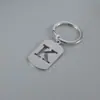 Venta Caliente de Productos Nuevos Transfronterizos 26 Letras Inglesas Huecas de Acero de Titanio Sin Decoloración Accesorios de Joyería Llavero 26 Letras