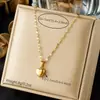 Elegante collar con colgante en forma de corazón incrustado de diamantes, un superventas transfronterizo, acero inoxidable chapado en oro, cadena decorativa para la clavícula delicada y fina para mujer