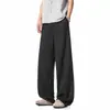 Textura refrescante pantalones rectos color albaricoque claro líneas segmentadas tridimensionales holgados adelgazantes ligeros con caída pantalones hasta el suelo moda masculina