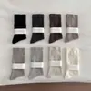 Calcetines de mujer sin costuras para primavera y otoño, calcetines blancos postparto de caña suelta, calcetines holgados de color liso estilo japonés, calcetines largos minimalistas