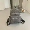 Mochila com estampa de estrelas, grande capacidade, simples e versátil, adequada para estudantes, estilo coreano, com estampas de letras e um visual preppy de faculdade.