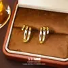 Pendientes de botón geométricos de arco hueco simples de aguja plateada para mujer, estilo europeo y americano, pendientes versátiles, diseño de moda de nicho, joyería para el oído