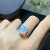 Anillo de ópalo explosiones naturales plata S925 joyería femenina piedra principal 10x 12 cruz caliente transfronterizo una generación de salidas de fábrica