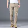 Calças Casuais Masculinas Novas de Primavera e Verão, Cáqui Luxo Acessível Fashion Versátil Algodão Puro Jovens Elásticas Calças Compridas
