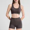 Conjunto de roupa de yoga transfronteiriço para o verão, com design vazado nas costas, top de ioga, shorts de ioga que afunilam a cintura e levantam o quadril