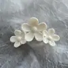 Comércio exterior atacado europeu e americano simulação de mármore doce bauhinia grampo de cabelo tinta spray brilhante camélia três clipes de flor