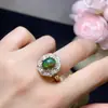 Anillo de ópalo negro iridiscente natural con una piedra principal de 8*10 mm, finamente elaborado con plata de ley 925