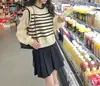 Suéter de punto de manga larga con costuras de gasa de cuello redondo de moda, top corto a rayas que estiliza para mujer, primavera y verano