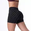 Conjunto deportivo europeo y americano de sujetador sin costuras de nylon de alta elasticidad con estampado de lunares y cuello halter y pantalones ajustados de cintura alta para levantar glúteos