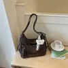 Bolsa Tote Retrô Melanoid Feminina Grande Capacidade 2026 Nova Outono Textura de Alta Qualidade Ombro Único Transversal Bolsa para o Dia a Dia