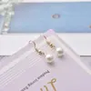 Pendientes de moda transfronterizos europeos y americanos, pendientes colgantes de perlas artificiales, temperamento simple, pendientes súper de hada