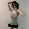 Ropa de mujer de comercio exterior, nuevo estilo coreano Dongdaemun, elegante y ajustada, cuello halter, sin espalda, favorecedora de la figura, top sin mangas versátil