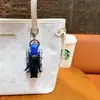 Criativo novo chaveiro de cachorrinho mecânico de voo de baixa altitude, divertido brinquedo transformável para alívio do estresse para estudantes, pequeno pingente atacado