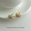 Pendientes de plata S925 estilo coreano de lujo ligero con perla cepillada, lazo y corazón, exquisitos y sofisticados, modernos y versátiles.