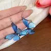 Pendientes irregulares de resina con aguja plateada y diseño hueco, estilo simple y único, sensación lujosa y de alta gama, pendientes exagerados al por mayor