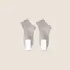 Calcetines blancos y negros para hombres y mujeres, calcetines de media pantorrilla para primavera y otoño, calcetines de algodón transpirables de color liso, calcetines deportivos para parejas, calcetines cortos de verano al por mayor