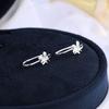Plata esterlina S925 versión coreana de aretes de flor de huevo liso dulces pequeños flor fresca clip para la oreja sin agujero en la oreja mujeres una generación de cabello