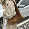 Bolso de axila de nicho para mujer 2026 Nuevo Otoño/Invierno Estilo coreano Moda Hueco Bolso de un solo hombro Versátil Bolso de mano para ir al trabajo