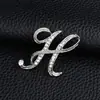 Temperamento de comercio exterior europeo y americano 26 broches de letras inglesas femenina diamante personalidad Joker moda corsage pin masculino accesorios