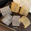 Pulsera de metal trenzada plisada multicapa abierta de estilo europeo y americano, una pulsera de moda de banda ancha exagerada, un accesorio delicado y versátil
