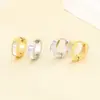 Pendientes de acero de titanio de moda en stock con superficie lisa e incrustaciones de concha para mujer, pendientes modernos y elegantes de acero inoxidable para regalar