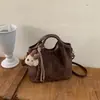 Bolso de Cubo de Mano Estilo Retro de Nicho Coreano Nuevo para Mujer Otoño Invierno Casual de Alta Gama para Viaje Diario Bolso de Hombro Único Cruzado