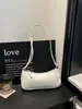 Couro PU, estilo vintage, design de nicho, bolsa de ombro sob o braço, bolsa de trabalho feminina, bolsa tote simples e casual, bolsa urbana em formato baguette