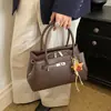Nuevo modelo de principios de otoño de 2026: Bolso de hombro, cruzado y de mano Kelly de alta gama, simple y versátil para el trabajo y el uso diario