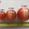Venta al por mayor de fábrica de adornos coloridos de ojo de gato, adornos para sala de estar, juego de balonmano, piedra de ojo de gato, bola de cristal, bola de Feng Shui
