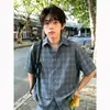 Camisa de cuadros suelta de manga corta estilo americano para hombres y mujeres, camisa fina de verano vintage con un diseño elegante, adecuada como chaqueta para parejas