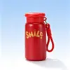 Nueva y elegante taza de bolsillo mini y portátil para mujer, hecha de acero inoxidable 316, con una correa para llevar