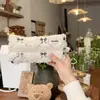 Bolsa de cosméticos al por mayor de lana de cordero para teléfono, maquillaje, monedero, sensación de alta gama, almacenamiento, bolsa de almacenamiento de sobre rojo en stock, lote