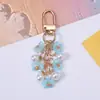 Llavero de flor de cerezo con perlas estilo ins, colgante floral simple para teléfono móvil, accesorio de decoración para bolso y mochila