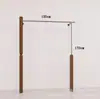 Estante de ropa de acero inoxidable montado en la pared para tienda de ropa, estante vintage color veta de madera de nogal, exhibidor de piso para ropa de mujer