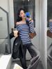 Guangzhou Huang Zheng Estilo Coreano Simples Elegante Listrado Contrastante Gola Uma Linha Ombro a Ombro Slim Malha Casual Top 530063