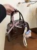 Bolso de diseño nicho estilo coreano ins súper popular para mujer, nuevo modelo 2026, alta calidad, exquisito, bolso simple de hombro y cruzado