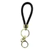 Venta al por mayor del fabricante Llavero de Cuerda de Aleación Tejida y Cuero Accesorios Colgantes Material PU Bolsas Pequeñas de Regalo Accesorios para Llaveros
