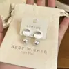 Pendientes de Tuerca Geométricos Plateados Cepillados de Otoño Sensación de Alta Gama 2026 Nuevo Artículo Popular Joyería para Orejas Perla Temperamento Pendientes Impresionantes