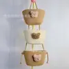 Cesta colgante de tres capas del fabricante Cesta de cuerda de algodón para Año Nuevo Decoración Cesta de almacenamiento de cosméticos de tres Ouli de dibujos animados Cesta para el hogar montada en la pared
