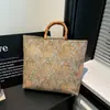 Bolso tote muy elegante, nuevo de moda primavera-verano 2026, estampado, gran capacidad, simple, versátil, chic, con asa de bambú
