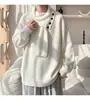 Suéter de tricô com design novo para o outono e inverno de 2026, com botões decorativos e tamanho grande