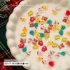 Populares Transfronterizos 12 Rejillas Dibujos Animados Adornos Navideños para Uñas Muñeco de Nieve Estéreo Reno Guirnalda Serie Navideña Decoraciones
