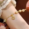 Pulsera de Amistad Nueva de Moda Estilo Ins Diseño de Nicho con Colgante de Campana Dorada Estilo Chino para Mujeres