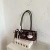 Bolsa de ombro com poá e laço transfronteiriça para mulheres, nova bolsa de ombro estilosa de nicho 2026, bolsa para o dia a dia