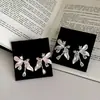 Brincos de Franja com Laço de Lírio para Mulheres Luxo Leve Temperamento Design de Nicho Brinco de Franja Brincos de Tarraxa de Flor Exquisitos para Mulheres