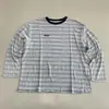 Camiseta de otoño nueva a rayas de manga larga, transpirable, para hombre y mujer, cuello redondo, corte holgado, top casual versátil, adelgazante para uso diario