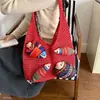 Elegante y versátil bolso de mano nuevo para 2026, perfecto para el trayecto diario en otoño, con un diseño de tote sencillo, textura tejida, gran capacidad y un patrón calado.
